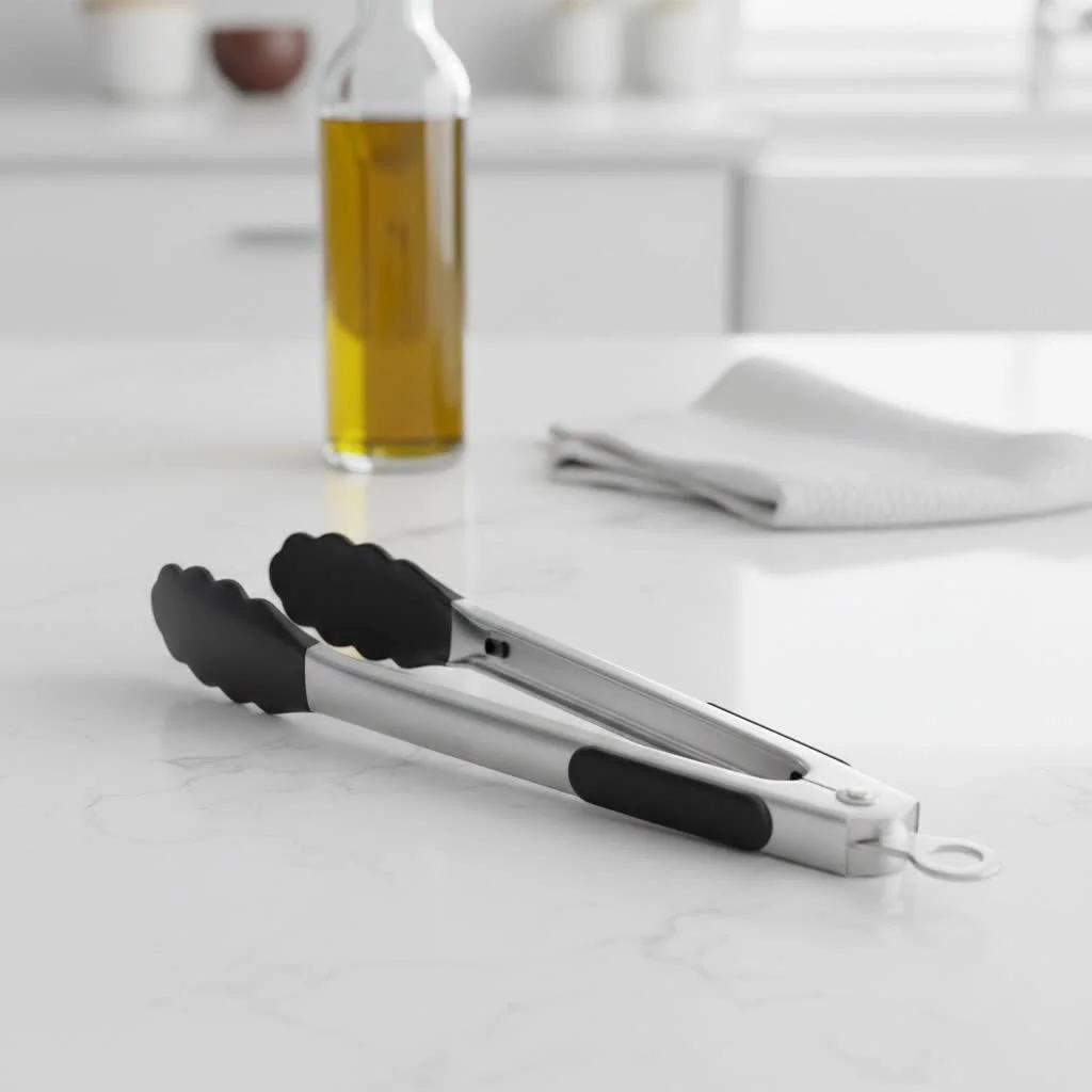 Chef using kitchen tongs to flip food